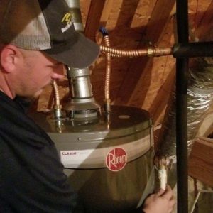 Technician performing a plumbing inspection